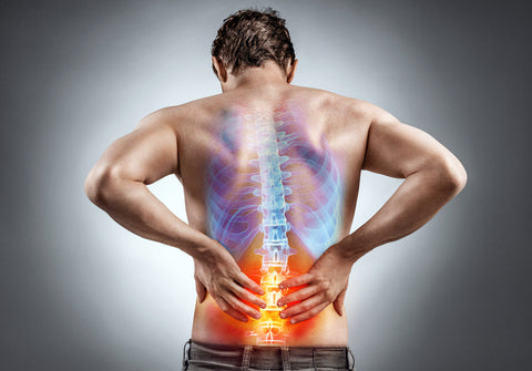 Man with lower back inflammation causing spinal pain