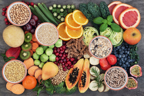 Vegan health food concept for high fibre diet with fruit, vegetables, cereals, whole wheat pasta, grains, legumes, herbs. Foods high in antioxidants and vitamins. Immune system boosting.