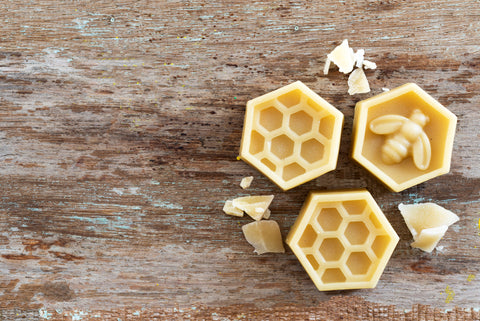 Beeswax on Wooden Background