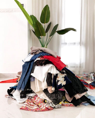 Clothes piled on the floor 