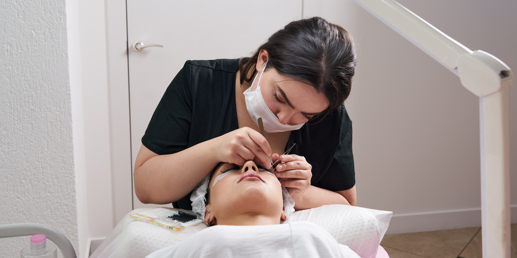 Woman having her lash extension infill session I Prolong Lash