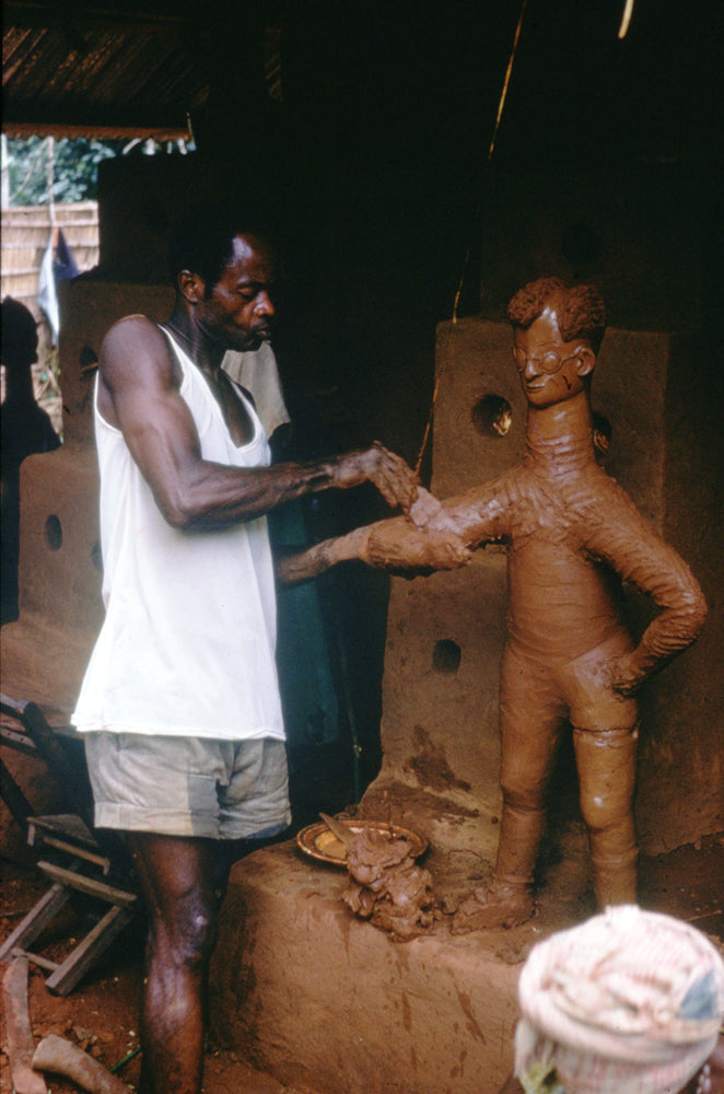 Igbo Mbari sculpting a clay figure