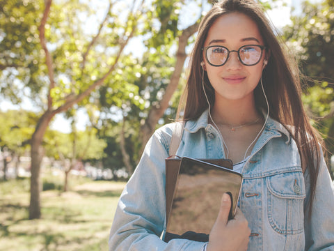 Girl holding books going to school