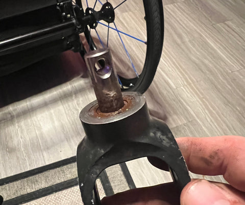 Picture of TiLite Aero series fork stem removed from a wheelchair with a corroded fork, top view.