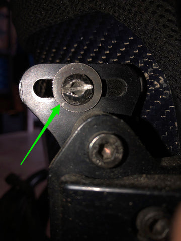 image of wheelchair hex screw with green arrow pointed towards slot cut in screw head.