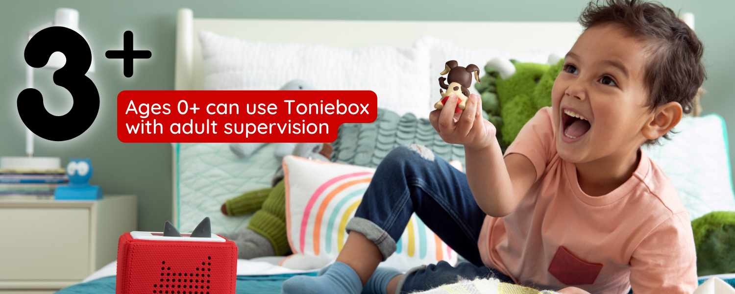 for ages 3+, ages 0+ can use toniebox with adult supervision. Image of child laughing at and holding a puppy tonie figure.