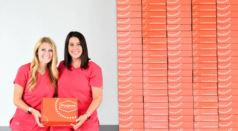 COTAs Holly Masters and Ali Izzo holding Purpose Therapy Box