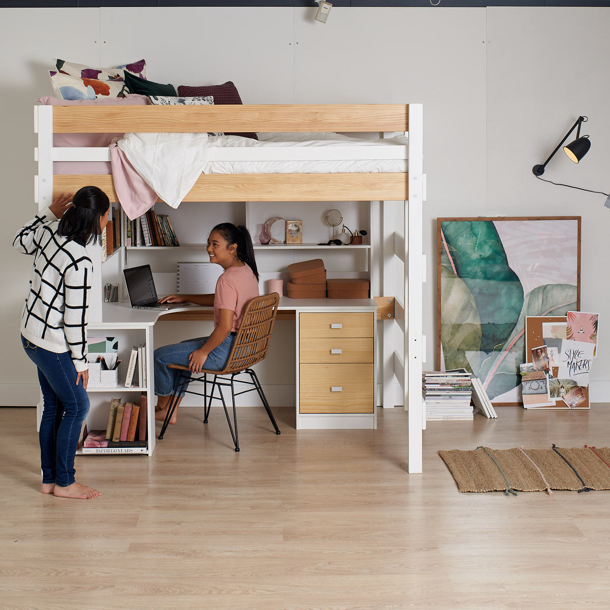 double loft bed over L shaped desk with storage drawer and shelf unit