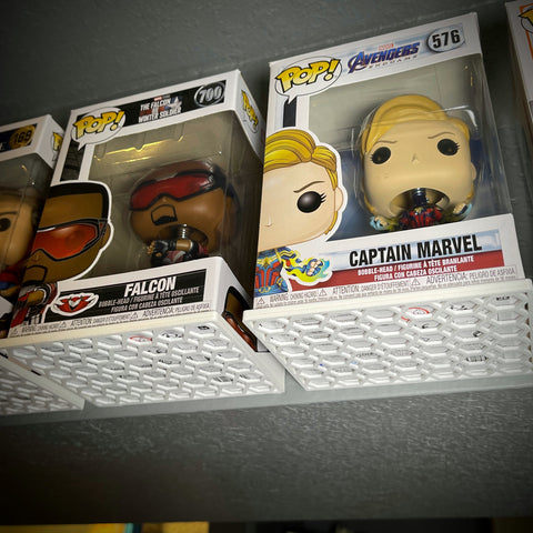 Using command strips to mount Funko floating shelves on the wall - wall mount for Funko boxes