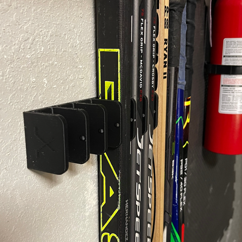 Keep your hockey sticks organized with this 10-stick hockey stick holder, mounted in the garage. 