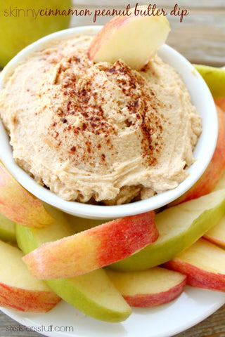 bowl of cinnamon peanut butter dip with apple slices