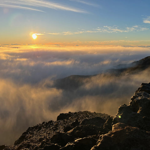 Sun rising above clouds on Haleakala