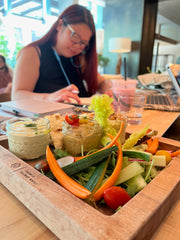 Working in background with veggie platter in forefront