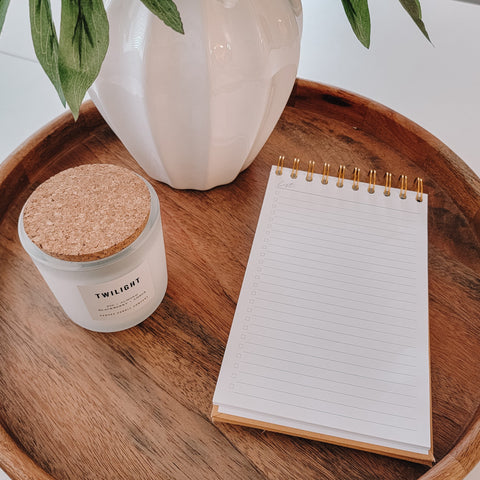 Lists Spiral Notepad on tray with candle and plant