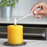 How to extinguish a beeswax pillar candle by dunking the wick