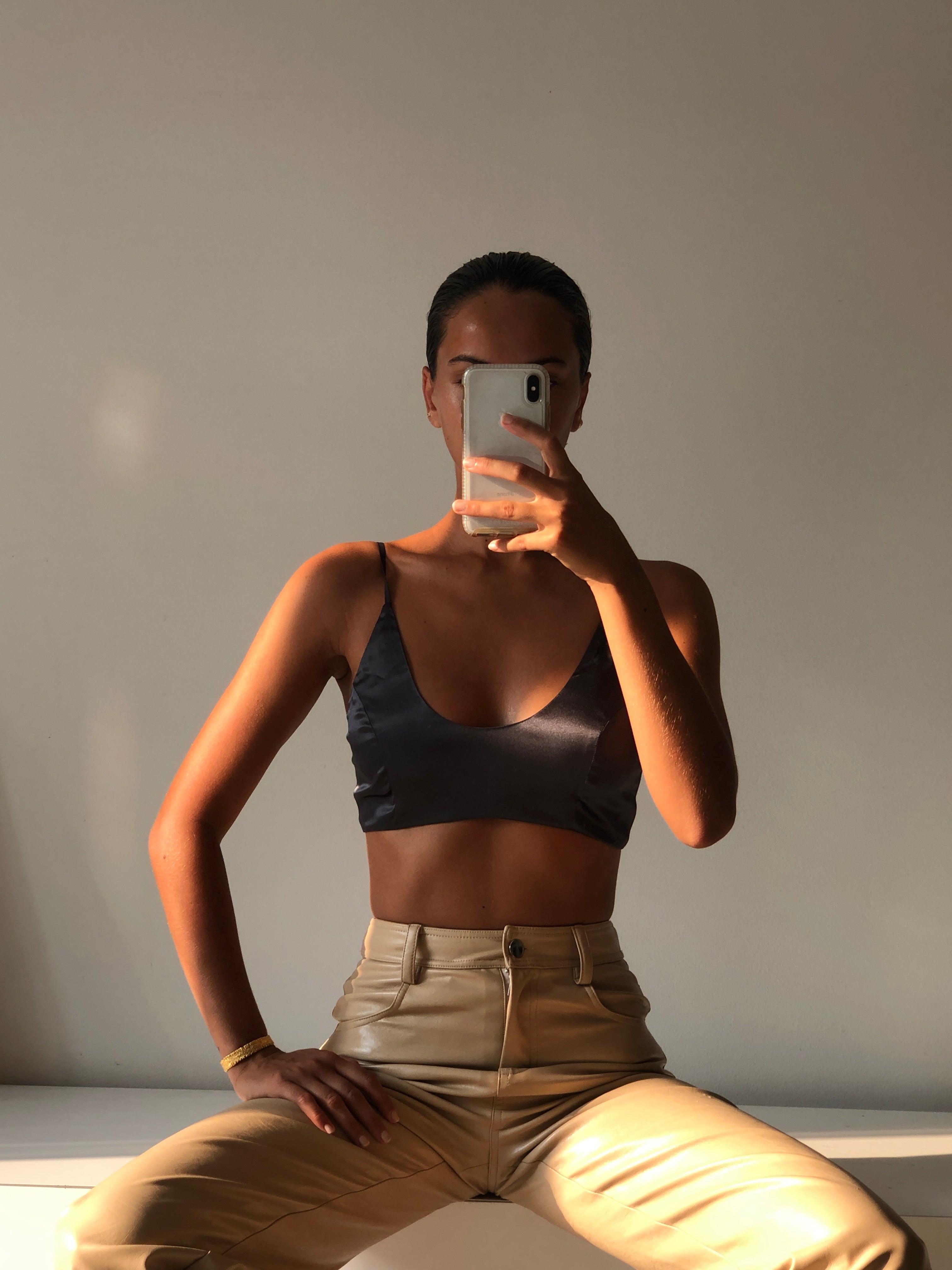 Bella wears Bay scoop neck silk bralette in forest