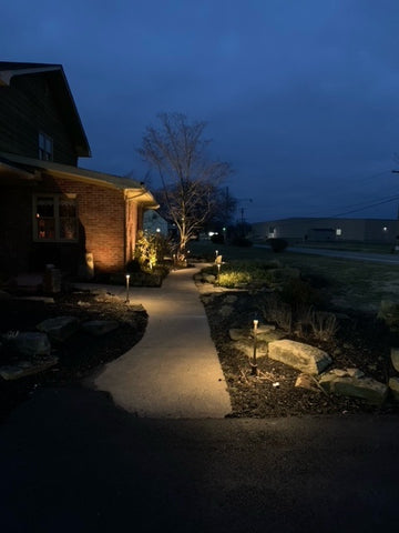 House at night with landscape lighting