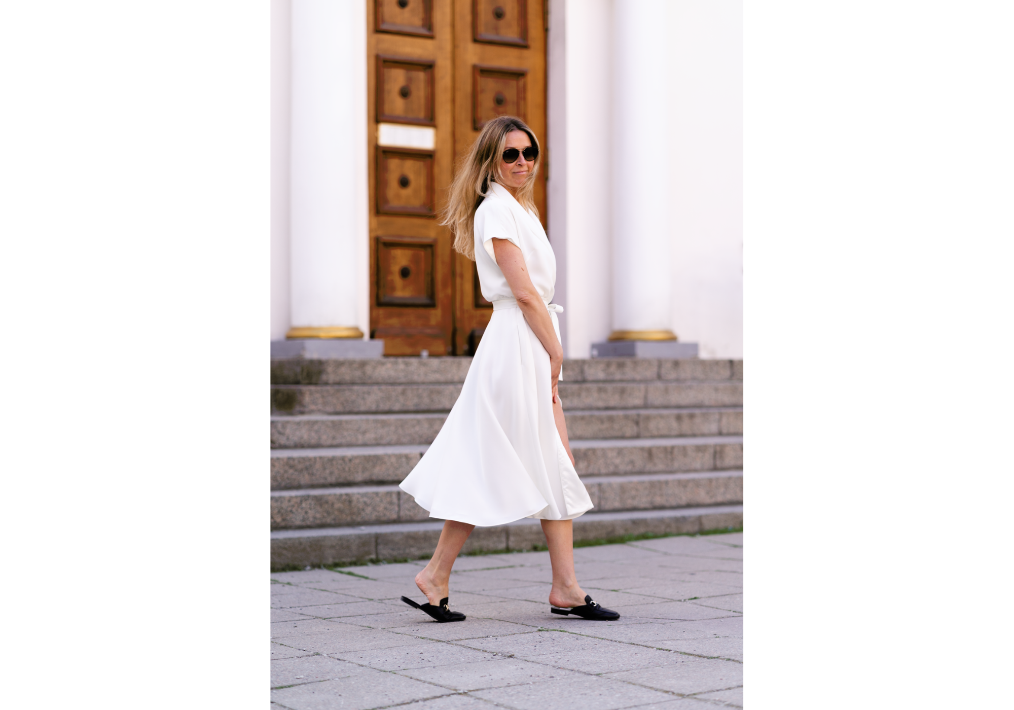 Woman wearing an elegant white wrap dress