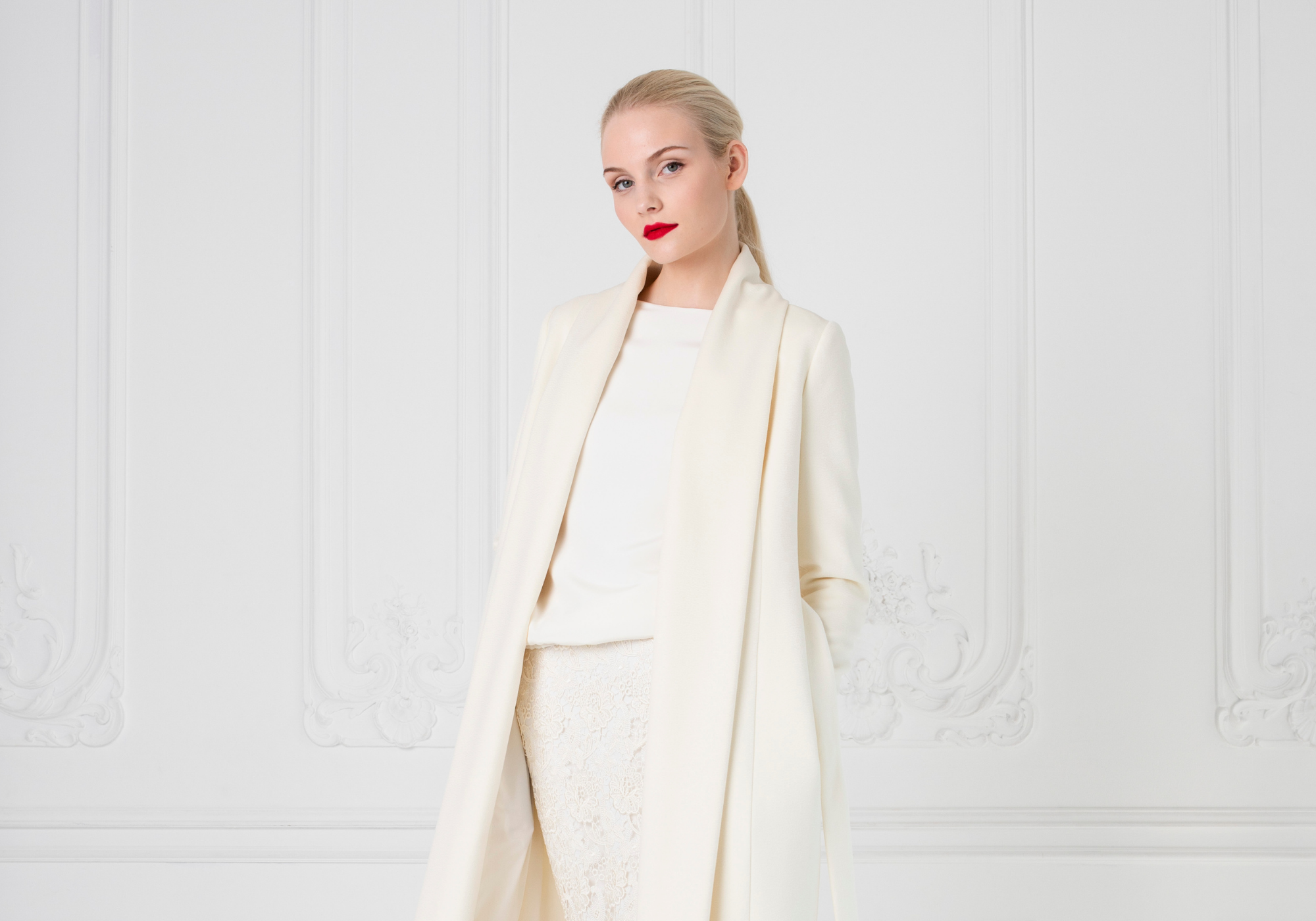 woman wearing a cashmere ivory coat