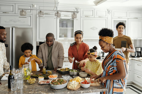 Family getting dinner plates ready Photo by August de Richelieu from Pexels