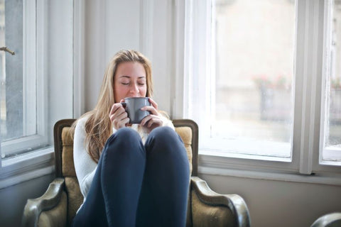 woman sitting and drinking coffee