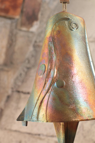 Bronze windbell with swirling design and rainbow-like surface finish