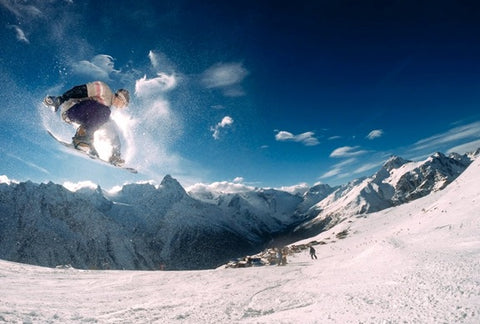 A snowboarder performing a stunt.