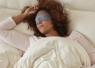 SHEEX Sleep Mask in Graphite on model in bed