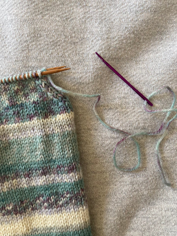 Kitchener Stitch step 2 - cut yarn and thread a tapestry needle