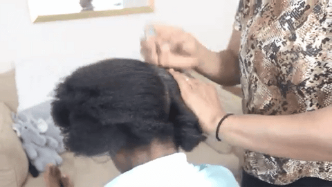 lady applying hair hold to hair