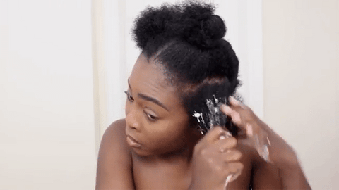 woman applying curl cream