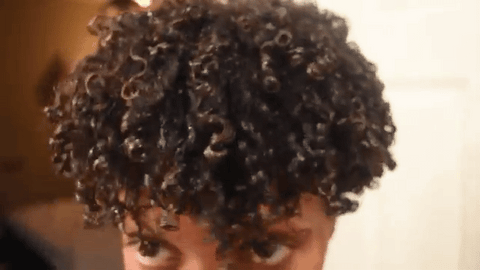 woman showing off her defined curls