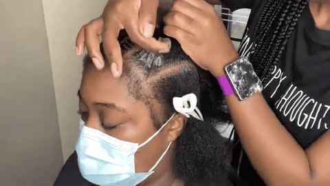 woman applying hair hold to hair