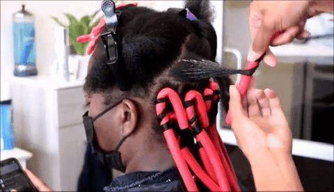 woman using flexi rods on hair
