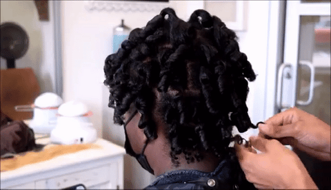 woman separating curls