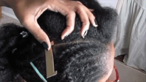 woman measuring and parting hair
