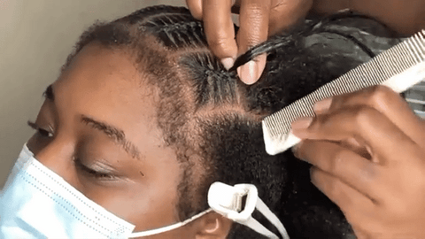 woman stitch braiding hair
