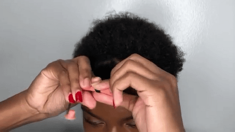 woman using flexi rods on natural hair