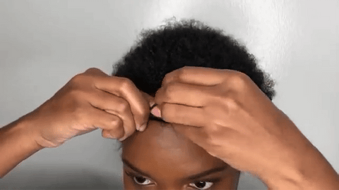 woman using flexi rods on natural hair