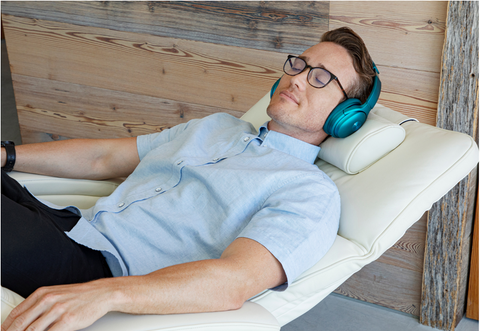 photo of a man sleeping in a zero gravity chair