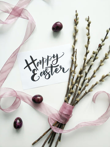 happy easter sign with stems and ribbon