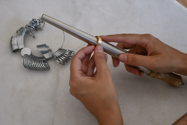 Measuring a ring size on a professional ring stick