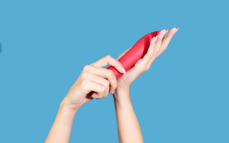 Image of hands holding a vibrator