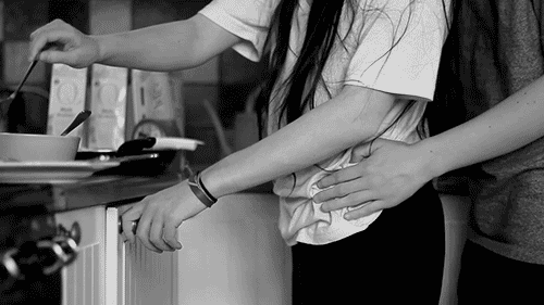 Gif of A Couple Hugging In The Kitchen