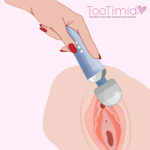 Hand holding massage wand on clitoris illustration