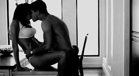 Gif of A Couple Making Out In Kitchen