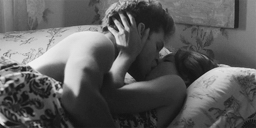 Gif video of couple making out in bed