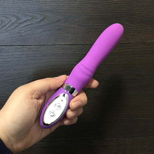 Pink B.O.B. Beginner's Silicone 10 Function Vibrator held in hand