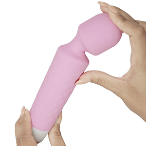 Small Lust wand massager in light pink being bent to show flexibility