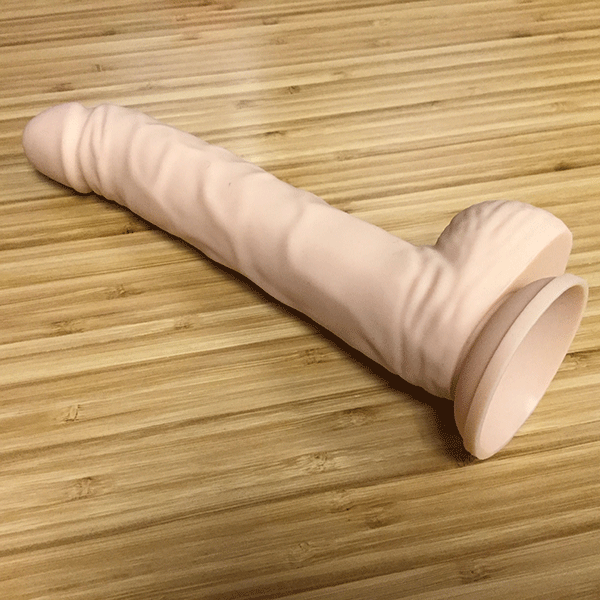pink bob suction cup dildo on desk